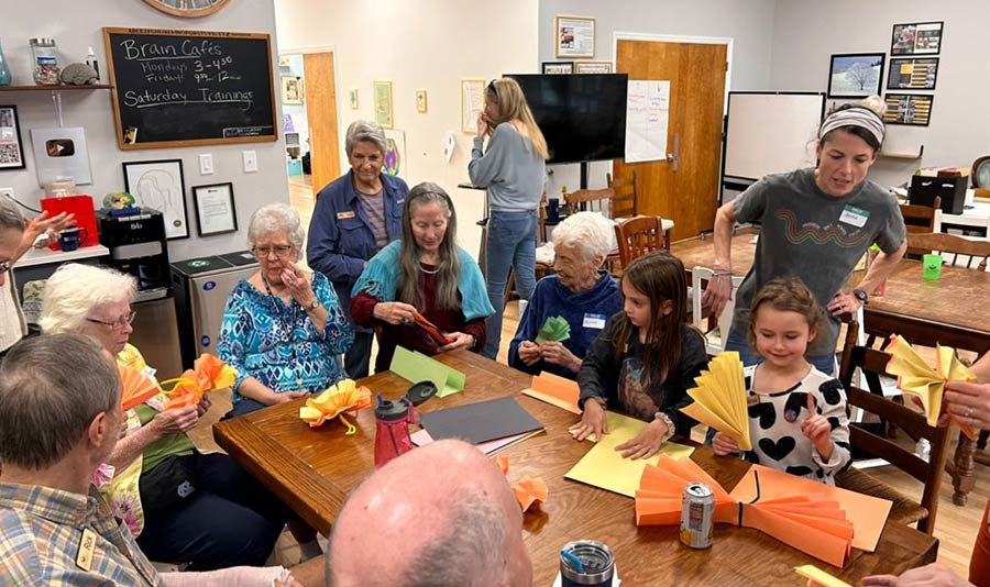 Photo of adults and children doing crafts