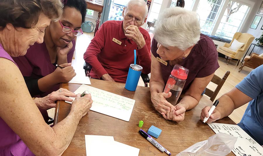 Photo of people talking around a table