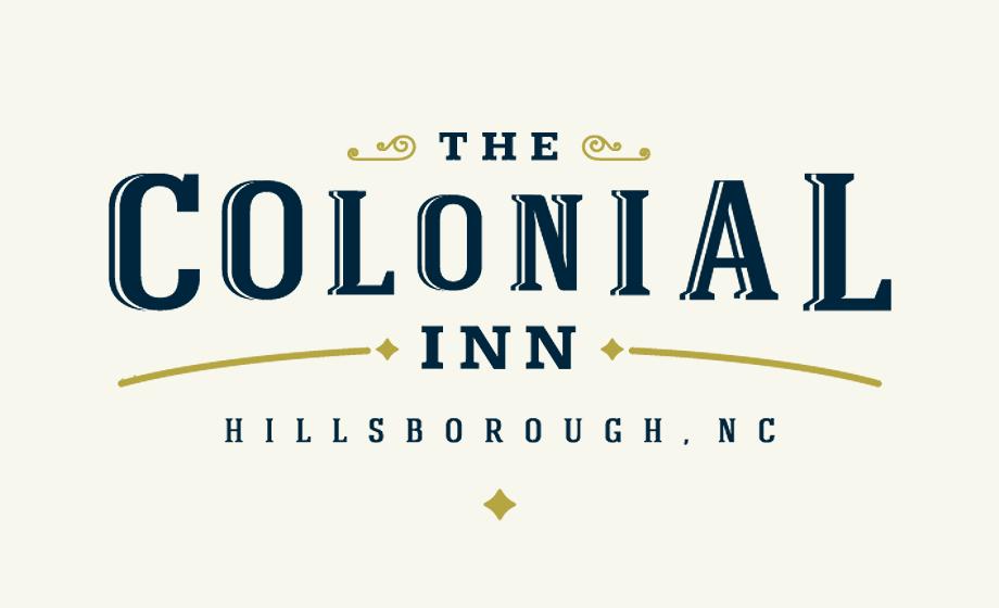 The Colonial Inn Logo - Dark blue serif type with gold accents over light gold background