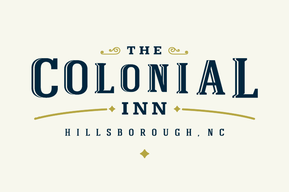 The Colonial Inn Logo - Dark blue serif type with gold accents over light gold background