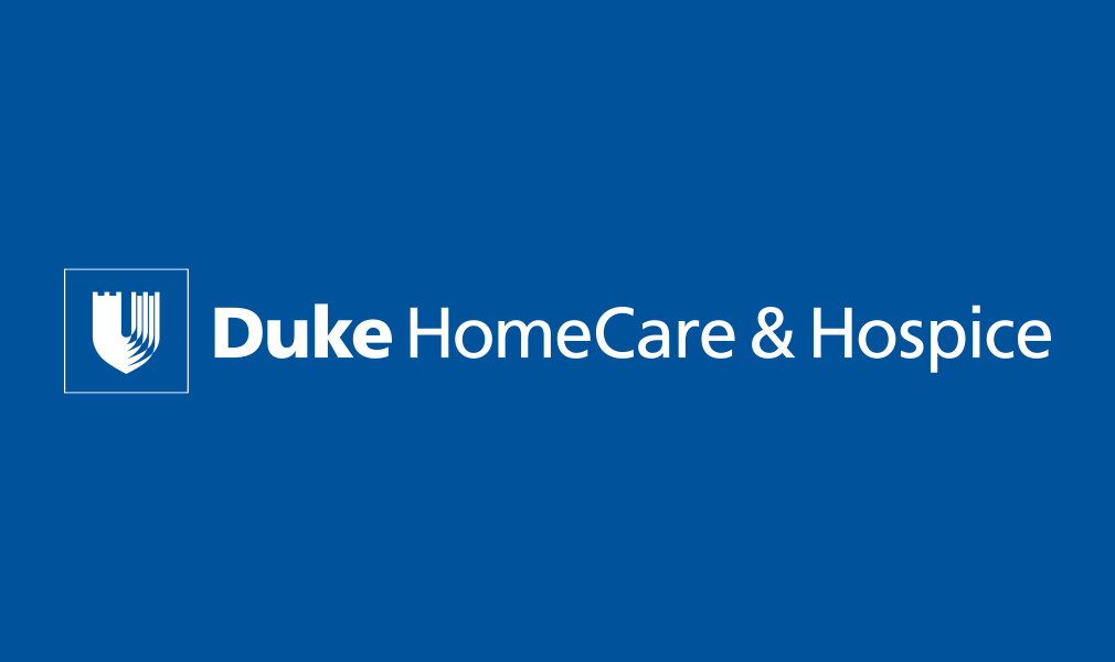 Duke HomeCare & Hospice Logo - White sans-serif type with stylized shield to left on blue background